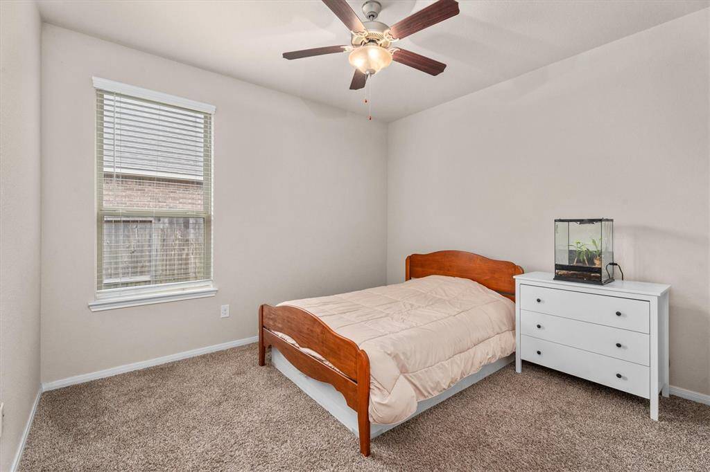 Cozy third bedroom with ample natural light.