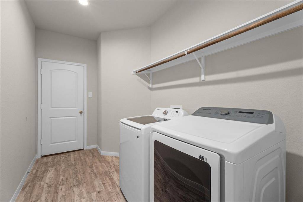 Enjoy the convenience of a spacious laundry room with direct access to a 3-car garage.