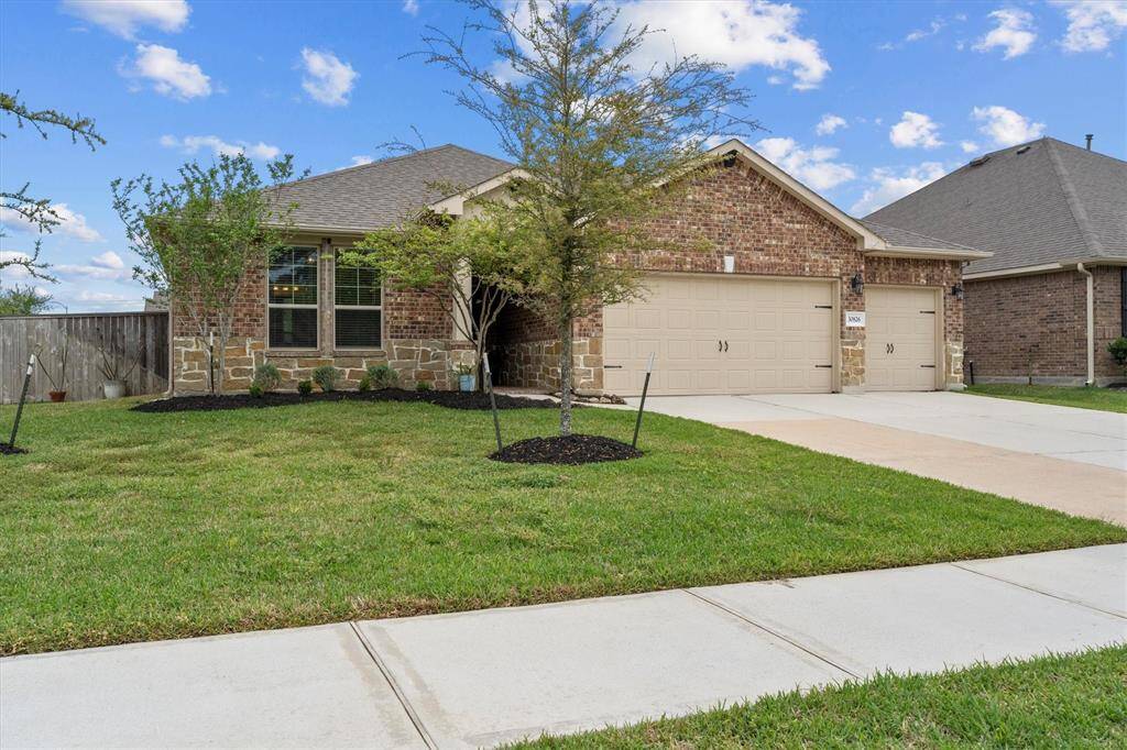 Trees in the front yard of this 1/4 acre, corner lot will provide shade for years to come.
