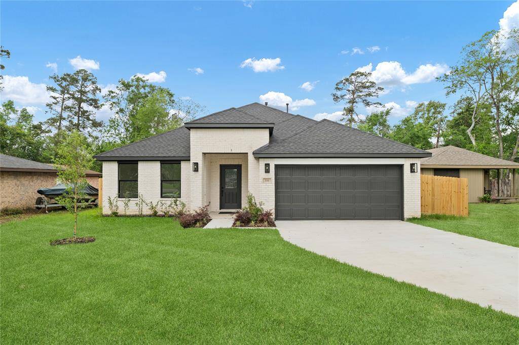 This home has charming curb appeal with manicured landscaping, a welcoming front porch, and classic architectural details.