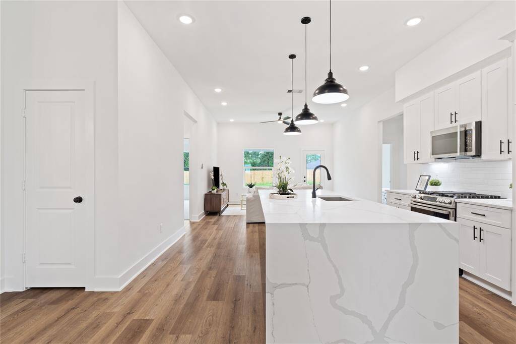 The room flows effortlessly into the living area and has easy access to the backyard.