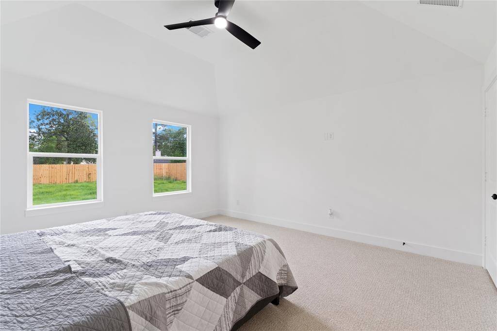 Large windows allow natural light to flow in and provide a view to the backyard.