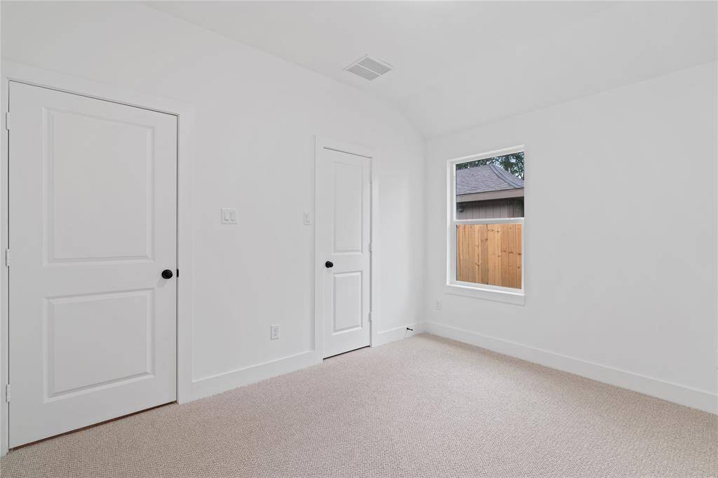With a high ceiling and simple, modern design, this room offers a peaceful retreat for every person in the home.