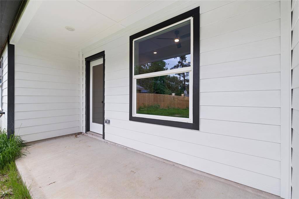 Step outside to the covered patio that offers a perfect spot for relaxing or entertaining.