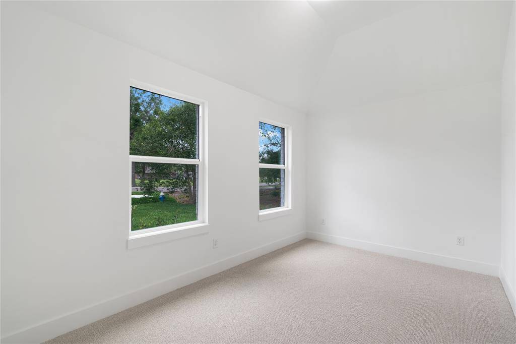 Bright and airy, this versatile room is perfect for a home office, study, gym, or additional bedroom.