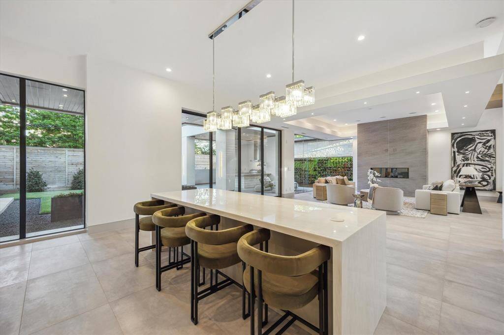Counter seating at center island with views to living room and backyard