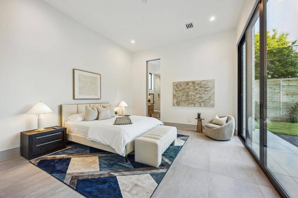 Downstairs guest suite with sliding door access to patio and backyard