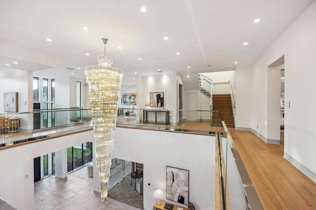 Second floor landing with wide plank white oak hardwood floors