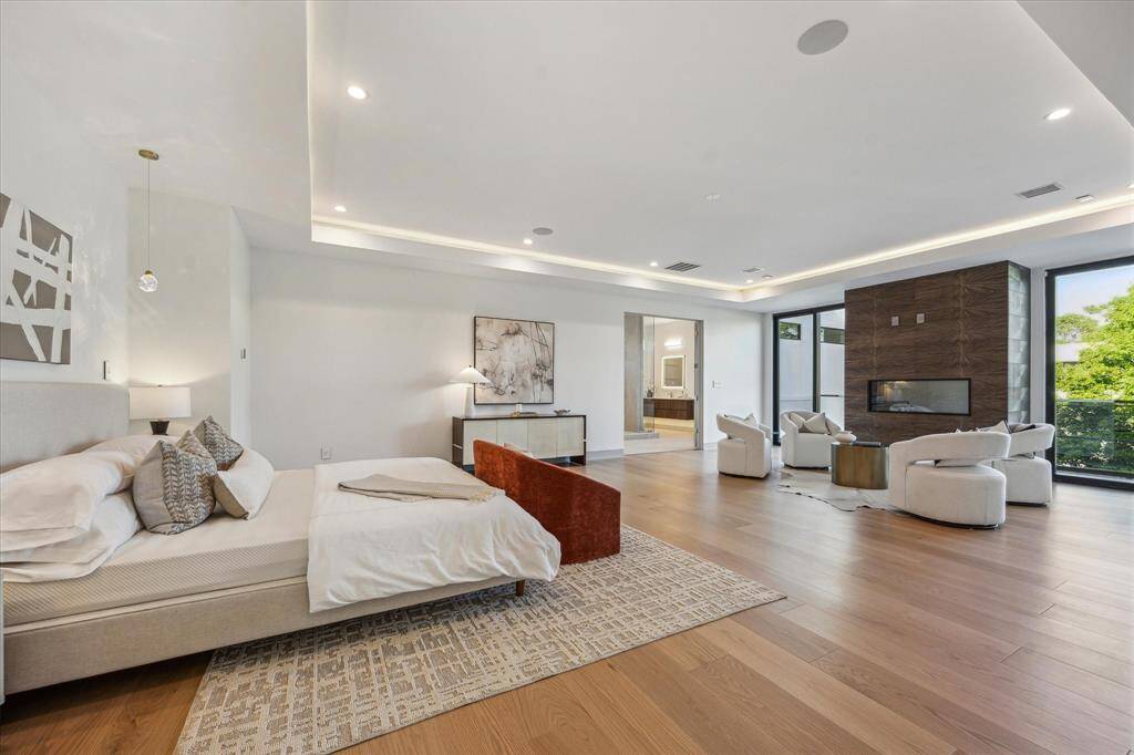 Primary bedroom suite with separate seating area