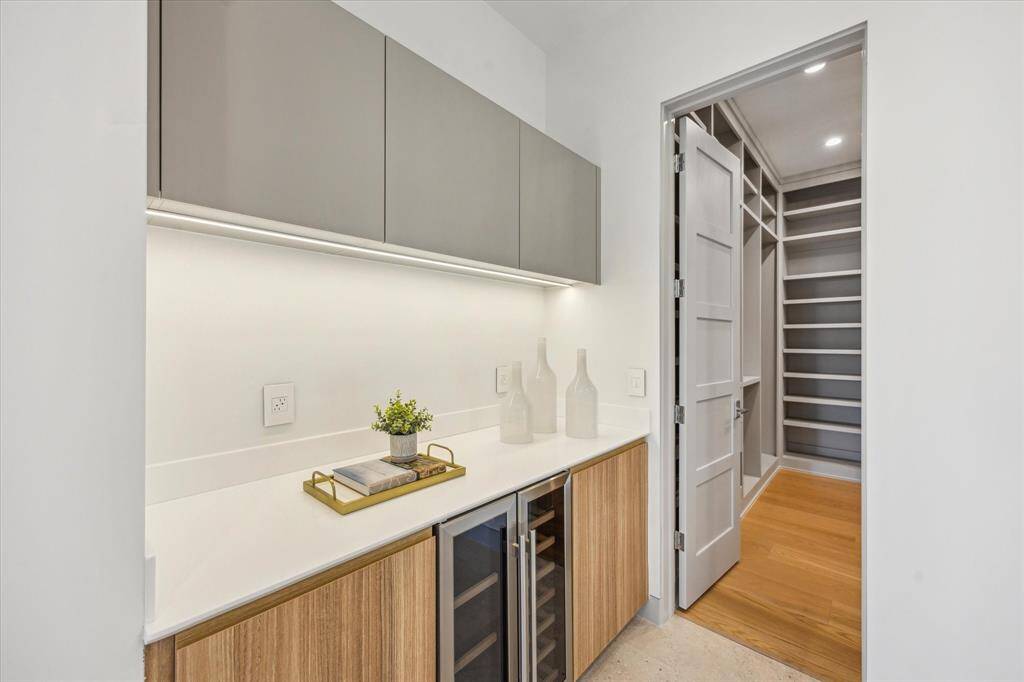 Coffee bar with beverage refrigerator in primary bathroom
