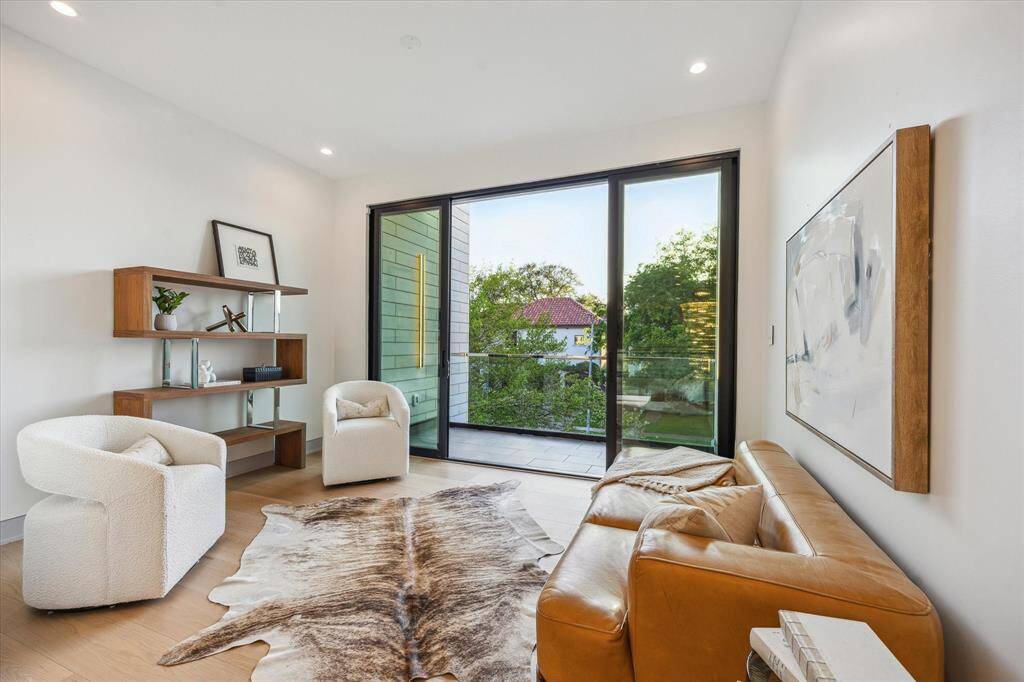 Second floor space can be used as additional study or sitting room. Views to front yard and balcony access.