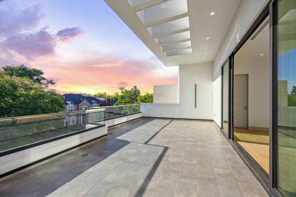 Large third floor terrace with lighting, glass railing with chrome handrail