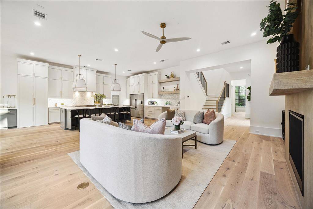The family room boasts a bright, open layout that seamlessly connects to the kitchen and other living spaces, creating a perfect flow for everyday living and entertaining. The open design enhances the sense of space, allowing for easy interaction between the rooms. Whether hosting gatherings or enjoying quiet moments, this central hub offers both comfort and style.