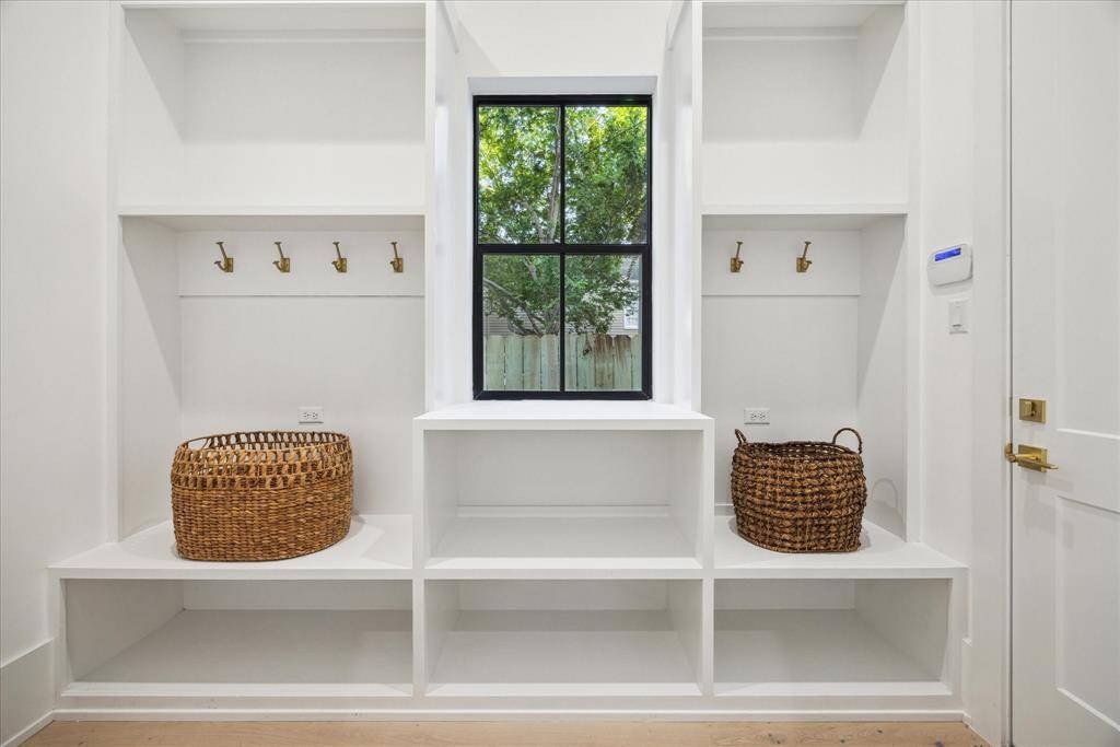 [MUDROOM] Thoughtfully designed for everyday ease, the spacious mudroom offers a seamless transition from the outdoors in. With custom built-ins plus ample storage, this functional space keeps your home effortlessly organized.  Whether coming in from a rainy day or heading out to the car, this stylish drop zone is as practical as it is polished.