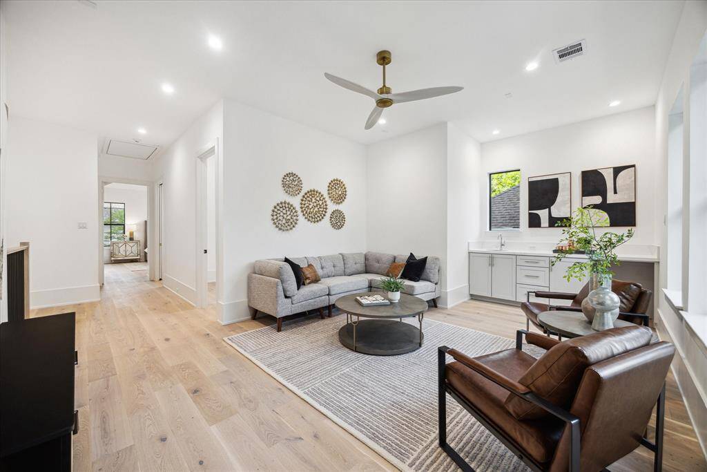 [GAME-ROOM] Upon reaching the second floor, you're greeted by a spacious game room with an open layout that invites relaxation and play. Versatile and modern, this upstairs living area offers endless possibilities for fun and functionality.