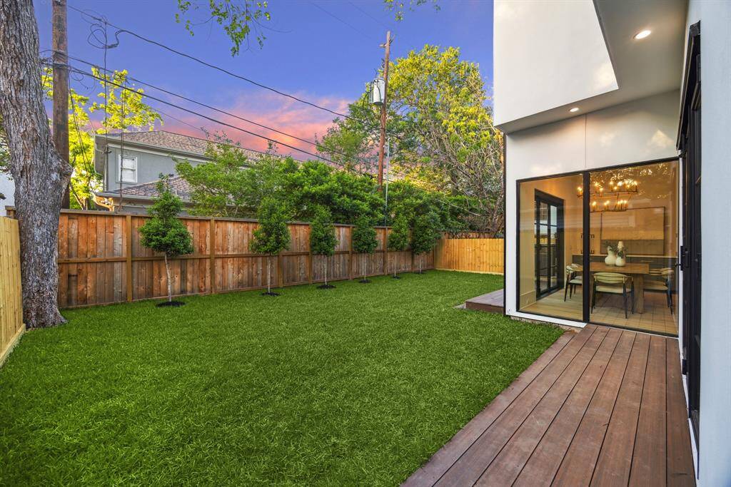 [BACKYARD] Step into a stunning, tree-lined backyard oasis—lush, expansive, and perfect for both play and peaceful moments. Framed by greenery, this private outdoor retreat offers endless possibilities for entertaining, relaxing, or simply enjoying nature’s beauty right at home.