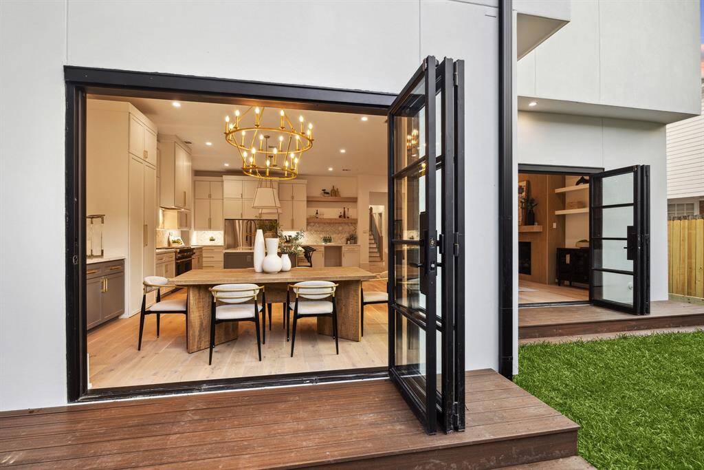 Experience the perfect harmony of indoor elegance and outdoor beauty with stunning glass door walls that blur the line between the two. Expansive views pour in through floor-to-ceiling glass, creating a seamless flow to the lush exterior and inviting natural light to fill the space. Whether entertaining or unwinding, this effortless connection to the outdoors elevates everyday living in the most breathtaking way.