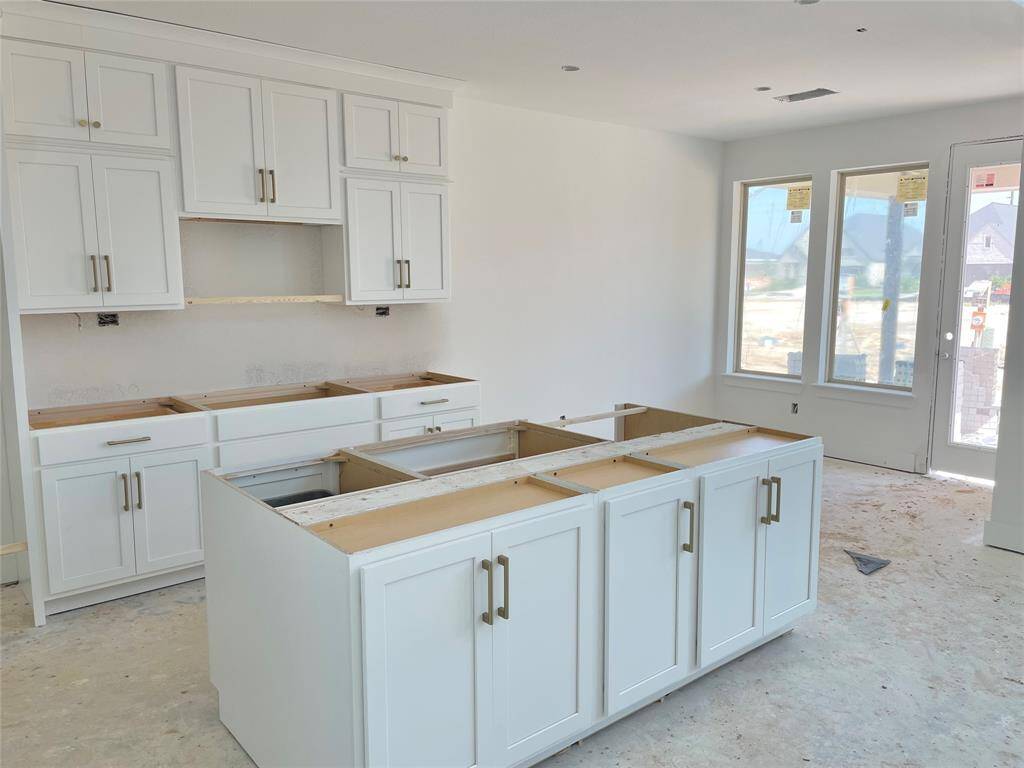 Open Island Kitchen With Tons of Cabinet Space