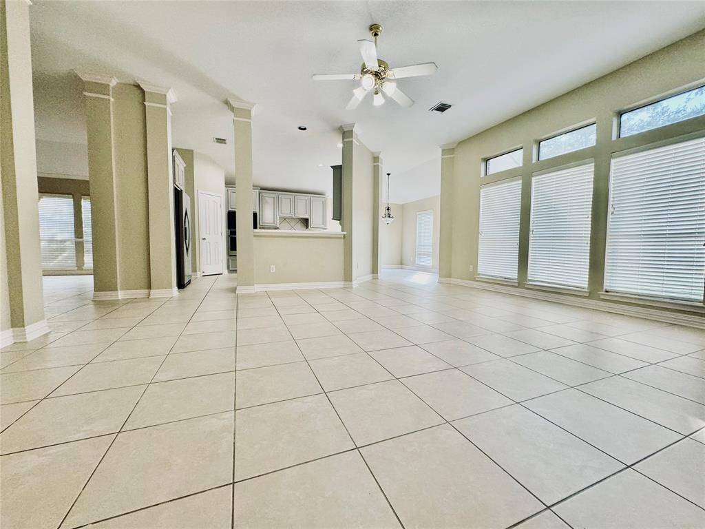 Family Room with high ceiling and lots of windows