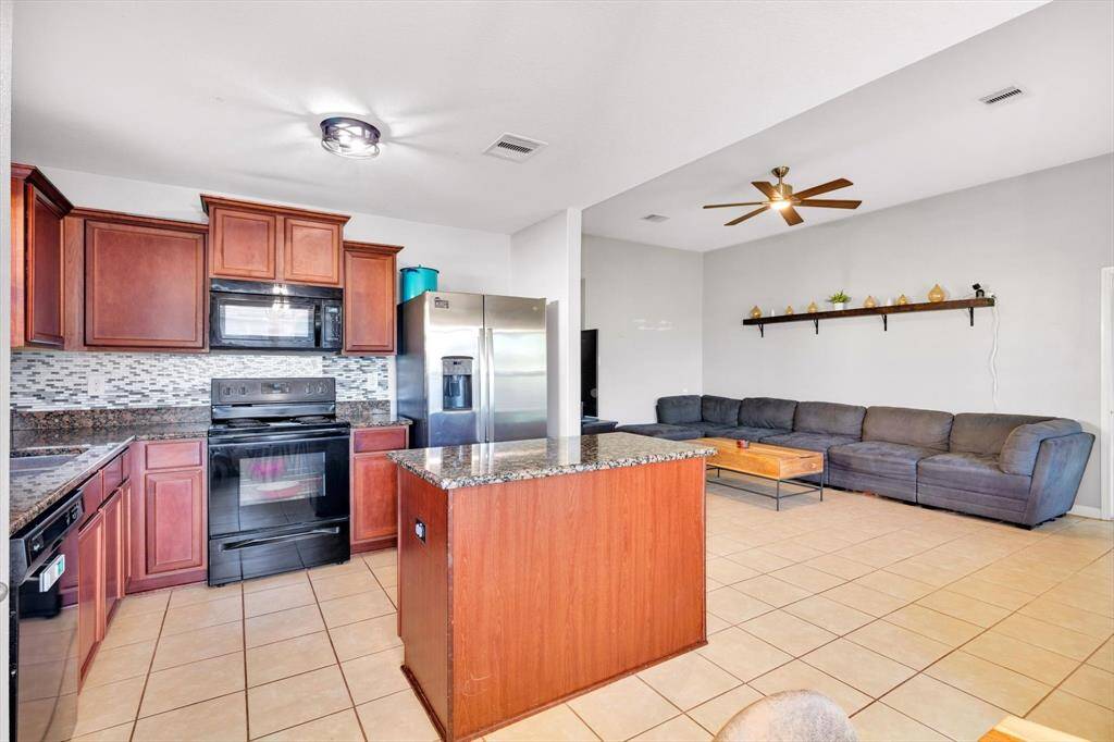 Kitchen with a view of the Living Room