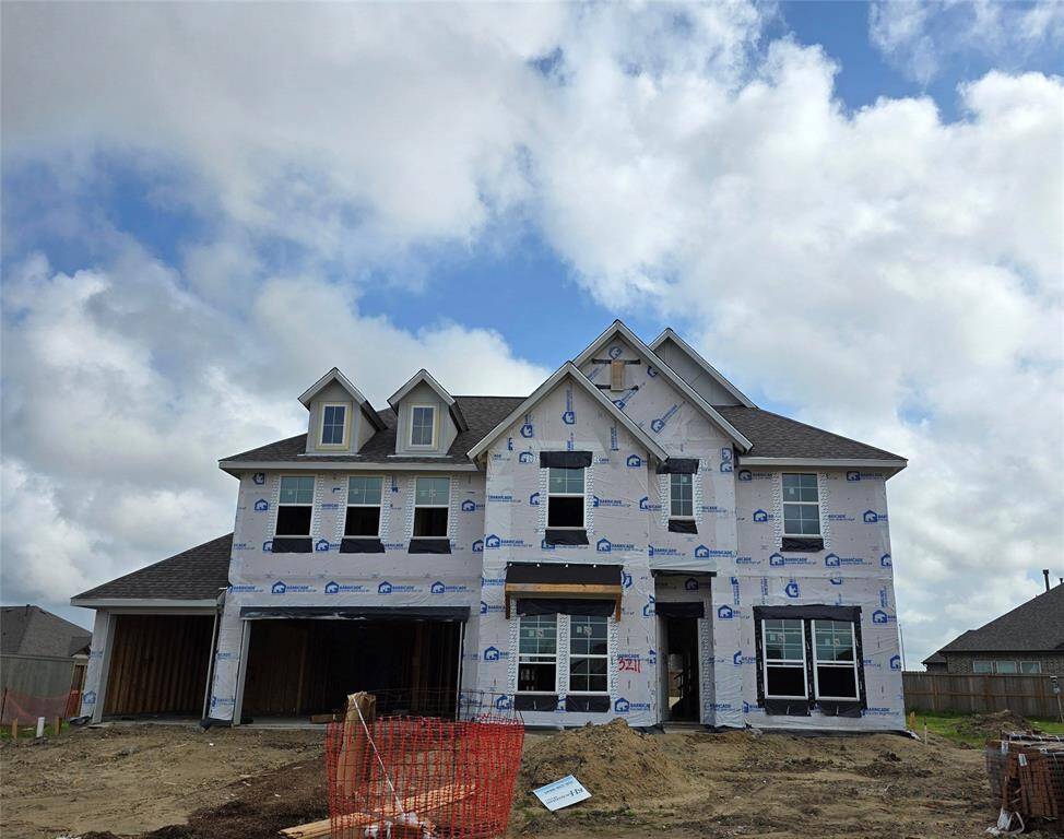 Two-story home with 5 bedrooms, 4.5 baths and 4 car garage