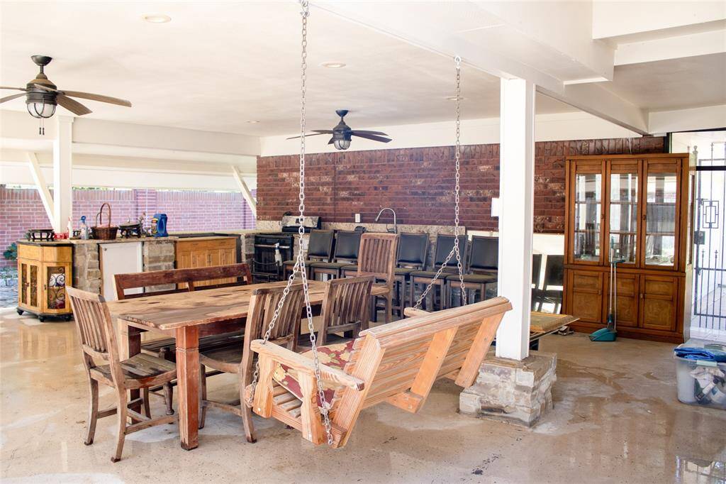Complete outdoor kitchen and large stone patio designed for year-round entertaining