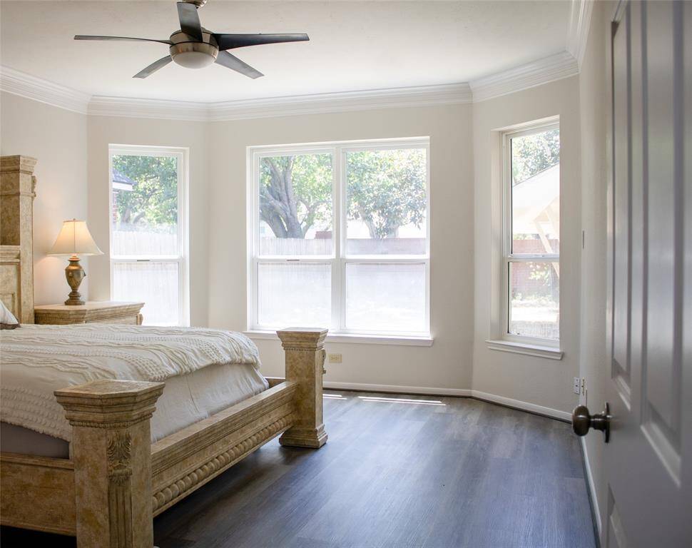 Serene primary suite featuring soft lighting, fresh paint, and an inviting atmosphere