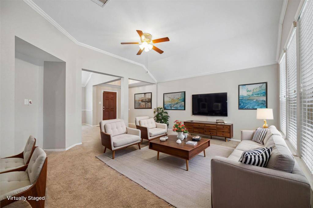 Spacious family room open to the kitchen with breakfast bar