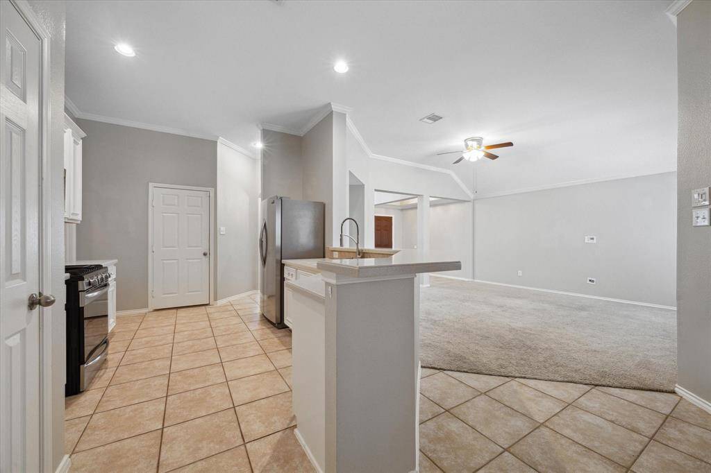 From the breakfast area looking into the family room and kitchen
