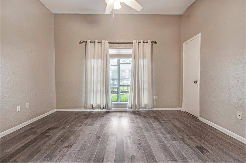 Secondary bedroom facing front of home with walk in closet.