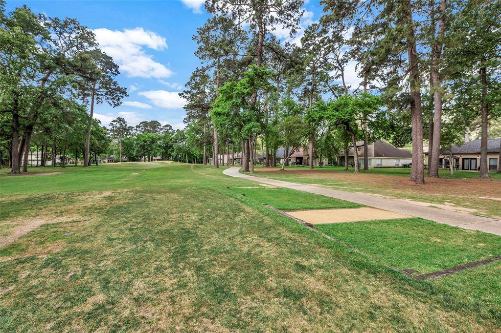 From the Tee box on the 17th hole of the Walden Golf Course - home is first one on the right in the photo- see the black trim?