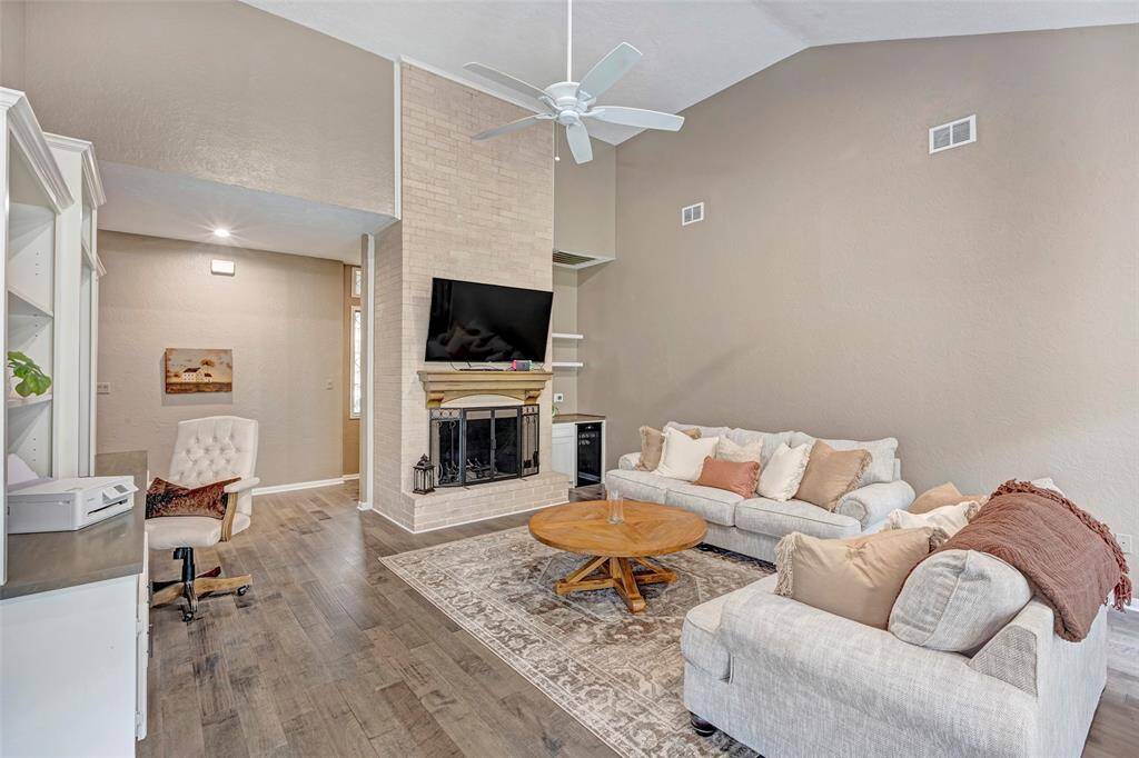 Open and spacious living at its finest. This family room is so impressive, beautiful floor to ceiling fireplace.