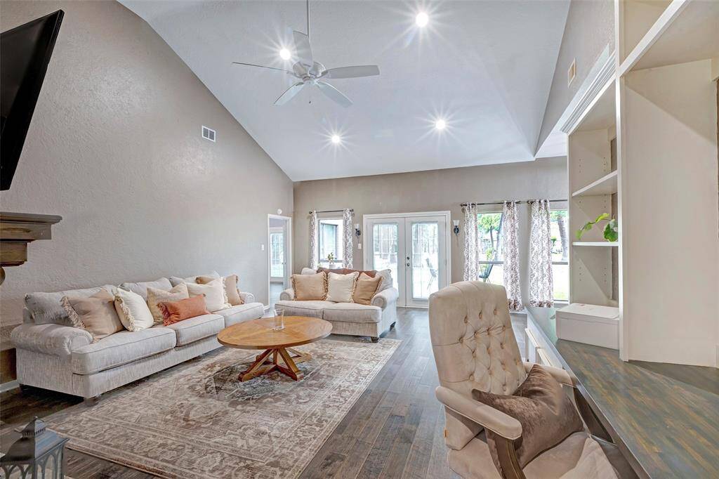 Notice the vaulted ceiling, numerous can lights and don't forget about all the natural light.