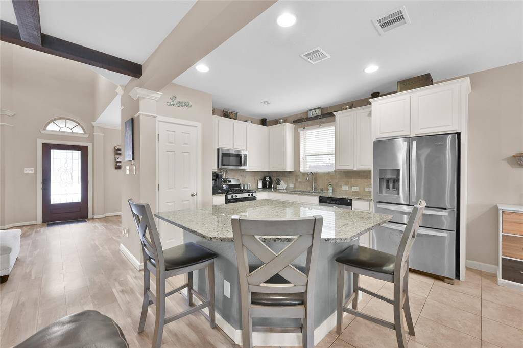 There is a big island for additional seating and a great spot for meal preps.