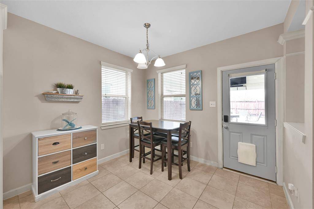 Another view of the breakfast area surrounded by windows and natural light.