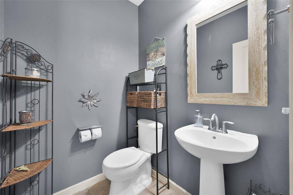 Convenient to the living area is this half bath with pedestal sink.