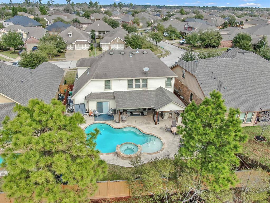 The pool was built in 2017 and the covered patio extended with summer kitchen in 2018! Extensive decking, spa and pool ledge for sunning.
