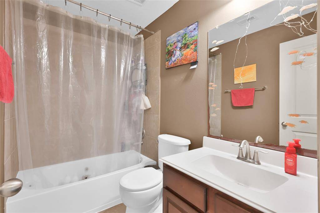 One of the secondary bathrooms with a tub/shower combo.