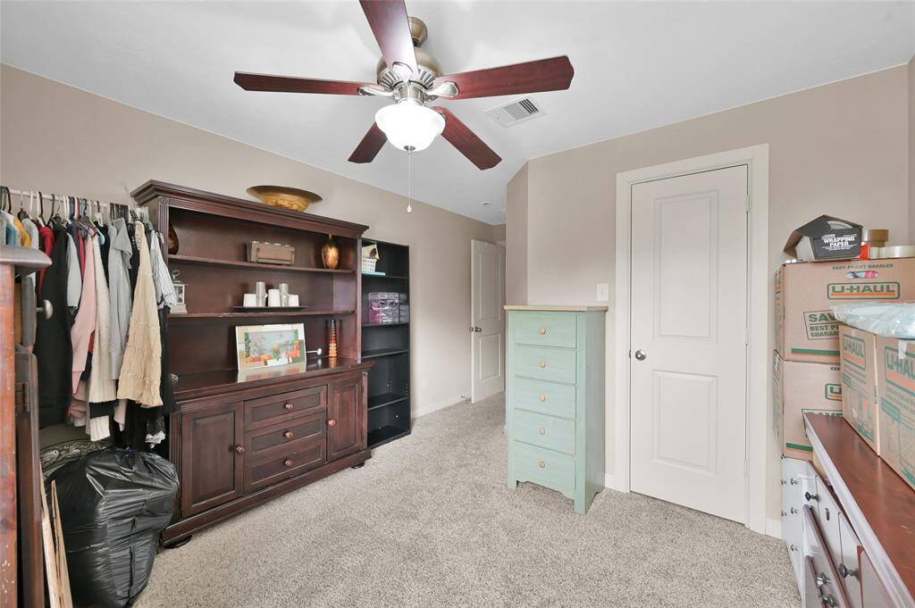 The fourth bedroom with walk-in closet.