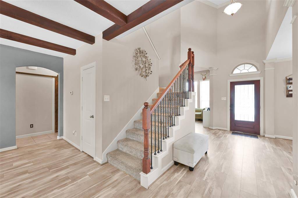 As you enter the home there is a two story entry flanked by a large study and formal dining room. The floors were upgraded to luxury vinyl plank in 2017.