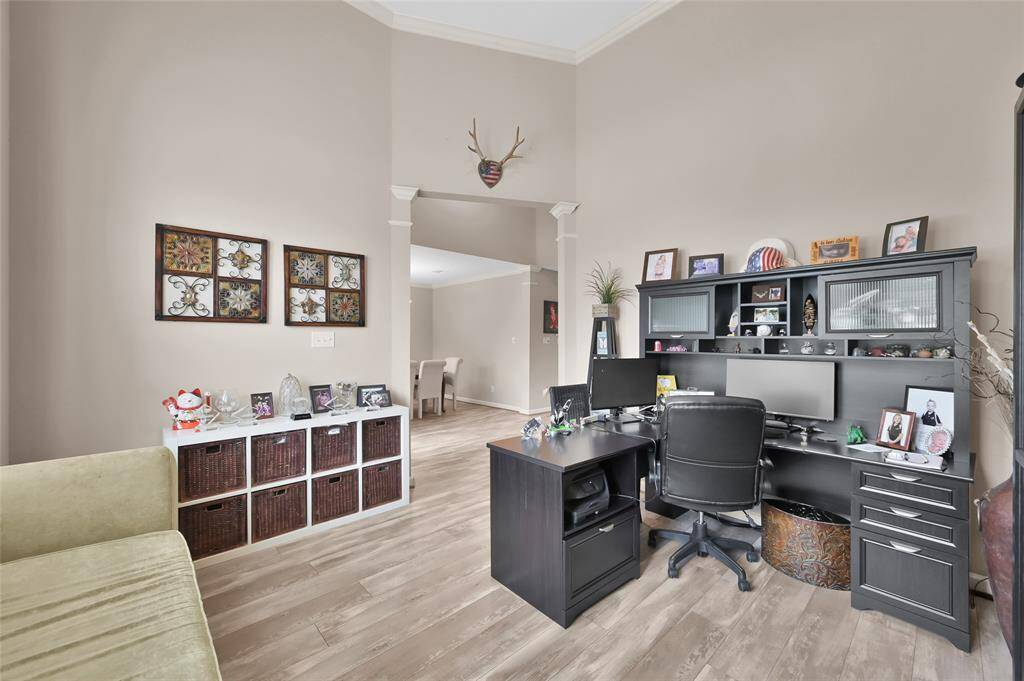 The study has a two story ceiling and the LVP continues in this space. Great for a home office or could be a playroom on the first floor.