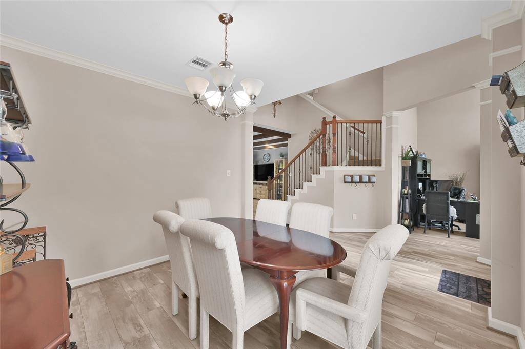 The dining room has crown molding and the floorplan flows for easy entertaining.