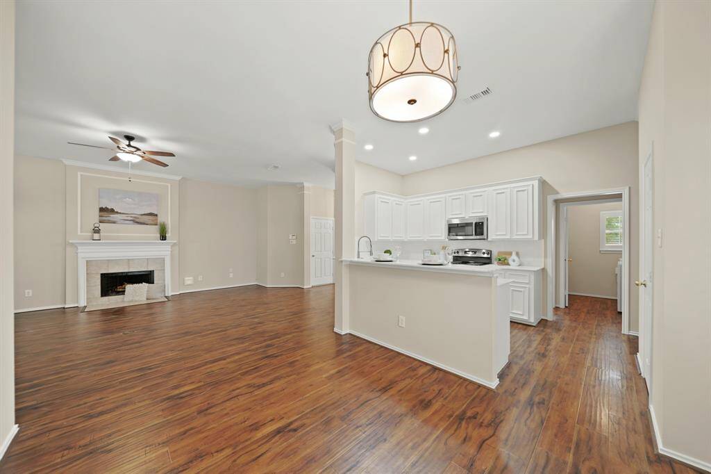 Open-concept layout offers seamless flow—perfect for effortless entertaining and family gatherings.