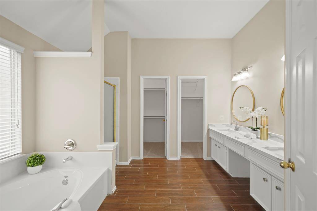 Primary bath with double closets.