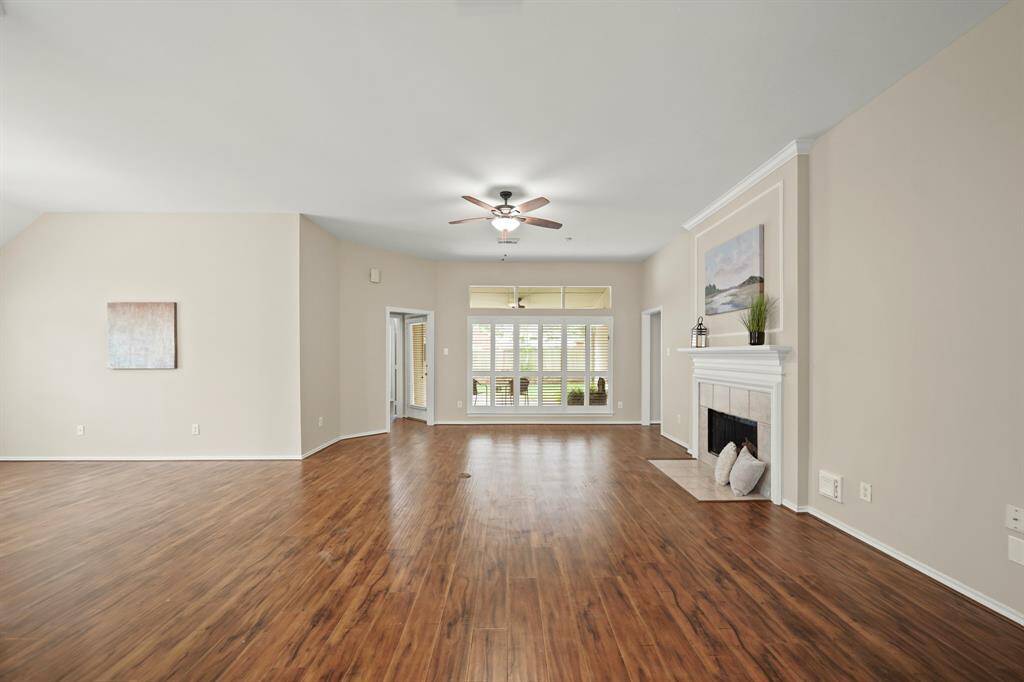 Spacious living area with abundant natural light and elegant plantation shutters.