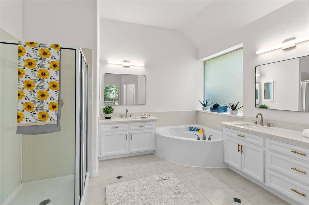 Primary bath with soaking tub and separate shower.