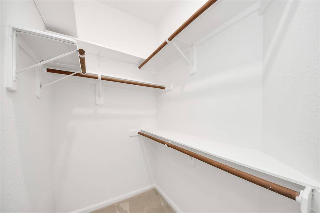 One of the walk-in closets in the primary bedroom