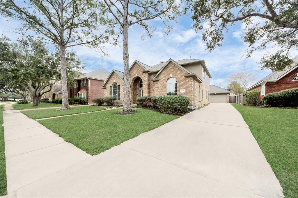 Long driveway leading to detatched garage