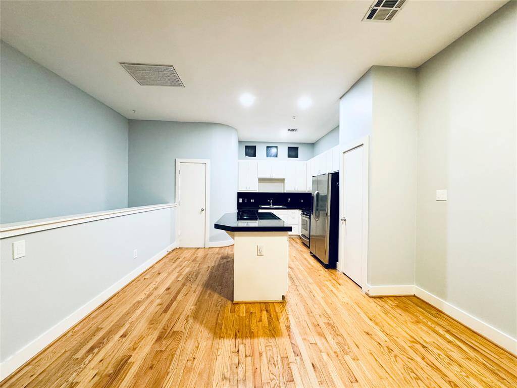 Dining opens into kitchen.
