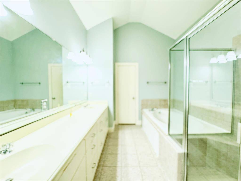 Oversized primary bath with separate shower and bath tub.